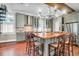 Bright kitchen featuring a central island with seating, stainless steel appliances, and custom cabinetry at 29 Smith St, Charleston, SC 29401