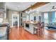 Open living room features a comfortable seating arrangement, brick accents, and exposed wooden beams at 29 Smith St, Charleston, SC 29401