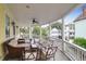 Spacious porch with ample seating and neighborhood views, great for entertaining at 29 Smith St, Charleston, SC 29401