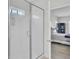 Modern shower bathroom with clear glass doors viewed from a hallway leading into a Primary bedroom at 312 Greenhouse, Summerville, SC 29485