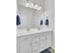 Bathroom featuring a double vanity with white cabinets, a large mirror and blue towels at 312 Greenhouse, Summerville, SC 29485
