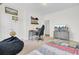 Spacious bedroom featuring a bed, desk, TV, and beanbag creating a versatile and comfortable living space at 312 Greenhouse, Summerville, SC 29485