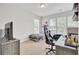 Bedroom with neutral walls, a large window, and a cozy bed creating a relaxing and inviting atmosphere at 312 Greenhouse, Summerville, SC 29485