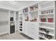 Organized closet boasting white shelves and drawers for shoes, books, and clothing at 312 Greenhouse, Summerville, SC 29485