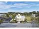 Aerial view of a community center with a spacious lawn, walkways, and parking at 312 Greenhouse, Summerville, SC 29485