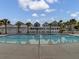 A large, inviting community pool area complete with lounge chairs and a shaded seating area at 312 Greenhouse, Summerville, SC 29485