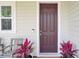 Charming front door with a Ring doorbell, flanked by potted plants and inviting seating at 312 Greenhouse, Summerville, SC 29485