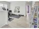 Home gym featuring exercise equipment, a mirror, and durable flooring for a complete fitness experience at 312 Greenhouse, Summerville, SC 29485