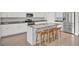 Modern kitchen featuring stainless steel appliances, a spacious island, and ample counter space at 312 Greenhouse, Summerville, SC 29485