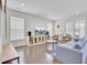 Bright living room featuring a stylish entertainment center and ample natural light from large windows at 312 Greenhouse, Summerville, SC 29485