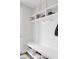 Bright mudroom featuring built-in shelving, coat hooks, and storage benches for organization and convenience at 312 Greenhouse, Summerville, SC 29485