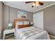 A bedroom featuring a full-sized bed, white nightstands, and a ceiling fan for added comfort at 314 Freeland Way, Moncks Corner, SC 29461