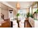 Elegant dining room featuring a glass top table, unique lighting, and ample natural light at 314 Freeland Way, Moncks Corner, SC 29461