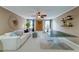 A well-lit game room featuring a ping pong table, couch, decorative wall hangings, and a ceiling fan at 314 Freeland Way, Moncks Corner, SC 29461