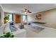 This game room is well-lit with a ping pong table, a comfortable couch, and decorative accents, perfect for Gathering fun at 314 Freeland Way, Moncks Corner, SC 29461