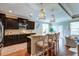This kitchen features granite countertops, stainless steel appliances, and rattan pendant lighting with barstool seating at 314 Freeland Way, Moncks Corner, SC 29461