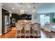 A kitchen featuring granite countertops, stainless steel appliances, rattan pendant lighting and barstool seating at 314 Freeland Way, Moncks Corner, SC 29461
