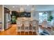 Modern kitchen with dark cabinets, stainless steel appliances, and a breakfast bar with seating at 314 Freeland Way, Moncks Corner, SC 29461