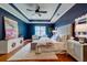 Bedroom with a tray ceiling, wooden floors, and decorative lamps at 314 Freeland Way, Moncks Corner, SC 29461