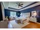 Inviting primary bedroom featuring a king bed, wooden floors, and large windows at 314 Freeland Way, Moncks Corner, SC 29461