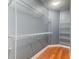 Walk-in closet featuring wall-mounted shelving and hardwood flooring at 314 Freeland Way, Moncks Corner, SC 29461