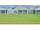 Spacious backyard features a charming patio and screened porch for outdoor living at 344 Seaside Trl, Summerville, SC 29486