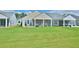 Well-maintained backyard featuring a screened porch and patio for outdoor relaxation at 344 Seaside Trl, Summerville, SC 29486