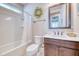 Clean bathroom featuring a shower-tub combo, floral accents, and modern fixtures at 344 Seaside Trl, Summerville, SC 29486