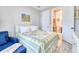 Cozy bedroom with a view to an ensuite bathroom, featuring bright walls and comfortable furniture at 344 Seaside Trl, Summerville, SC 29486