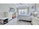 Bright bedroom features a ceiling fan, a mounted TV, and wood look flooring at 344 Seaside Trl, Summerville, SC 29486