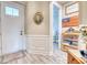 Inviting entryway featuring a decorative rug, wainscoting and an open doorway leading to another room at 344 Seaside Trl, Summerville, SC 29486