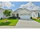 Charming one-story home with a two-car garage, lush landscaping, and well-maintained lawn in a quiet neighborhood at 344 Seaside Trl, Summerville, SC 29486