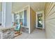 Welcoming front porch with rocking chairs, stone columns, and a cheerful entrance with wreath at 344 Seaside Trl, Summerville, SC 29486