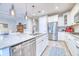 Spacious kitchen featuring a large island with bar seating, stainless steel appliances, and stylish pendant lights at 344 Seaside Trl, Summerville, SC 29486