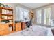 Bright office space with wood built-ins, an area rug and lots of natural light at 344 Seaside Trl, Summerville, SC 29486