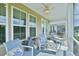 Cozy screened-in porch with comfortable seating and charming decorative accents at 344 Seaside Trl, Summerville, SC 29486