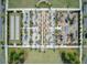 Bird's-eye view of the community park showcasing walking paths, playground, seating, and beautifully landscaped areas at 351 Gnarly Oak Ln, Summerville, SC 29485