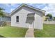 Backyard features a detached garage with white siding and door at 351 Gnarly Oak Ln, Summerville, SC 29485