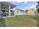 Backyard showing porch, garage, fence, and green space at 351 Gnarly Oak Ln, Summerville, SC 29485
