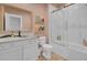 Bright bathroom features a vanity, commode and a tub with glass doors at 351 Gnarly Oak Ln, Summerville, SC 29485