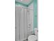 Bathroom with a shower and gray geometric shower curtain and shower head at 351 Gnarly Oak Ln, Summerville, SC 29485