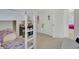 Bunk bed in a room with white walls, light carpet and white closet doors at 351 Gnarly Oak Ln, Summerville, SC 29485