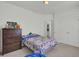 Bright bedroom features a colorful bedspread, closet, and a dresser at 351 Gnarly Oak Ln, Summerville, SC 29485