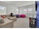 Second story bedroom or flex room with carpet, sofa, and multiple windows at 351 Gnarly Oak Ln, Summerville, SC 29485
