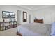 Bright bedroom featuring a large bed, TV, and dark wood furniture and light, neutral tones at 351 Gnarly Oak Ln, Summerville, SC 29485