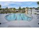 View of the community pool with palm trees, lounge chairs, and a modern pool design at 351 Gnarly Oak Ln, Summerville, SC 29485
