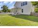 Side exterior view of home with a screened in porch and green grass at 351 Gnarly Oak Ln, Summerville, SC 29485