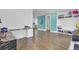 Hallway with a view of a ' room and bathroom, with hardwood floors and neutral paint at 351 Gnarly Oak Ln, Summerville, SC 29485