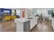 Kitchen with stainless steel appliances, including dishwasher, and an island with a quartz countertop at 351 Gnarly Oak Ln, Summerville, SC 29485