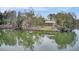 Charming waterfront pavilion with stone pillars and a classic roof, reflected in the calm lake at 351 Gnarly Oak Ln, Summerville, SC 29485